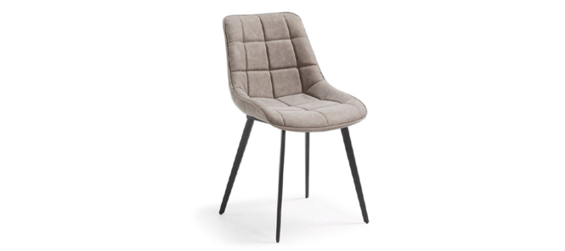 Light brown colour chair with black legs.