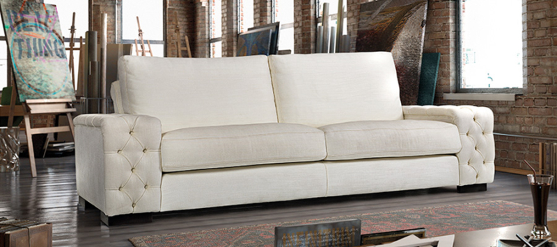 White elegant sofa in a big living room.