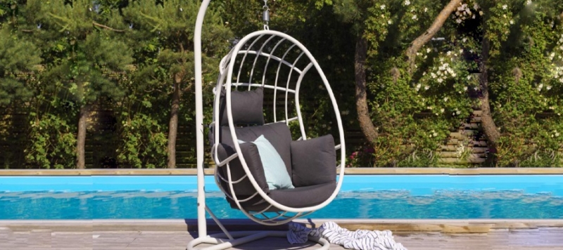 Brafab outdoor hanging chair in white colour near pool.