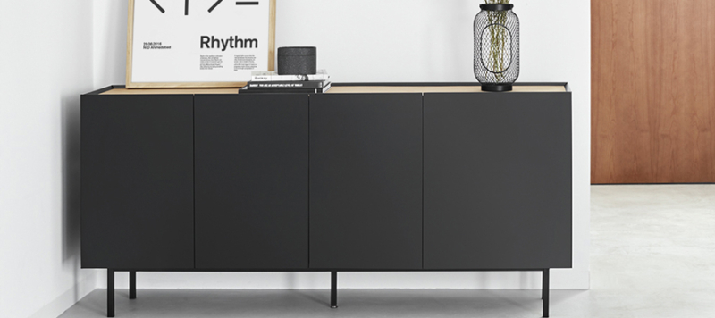 Teulat black console with wooden top and accessories in the living room.