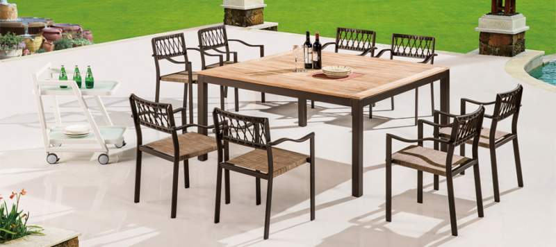 Outdoor yunge table with chairs in brown colour.