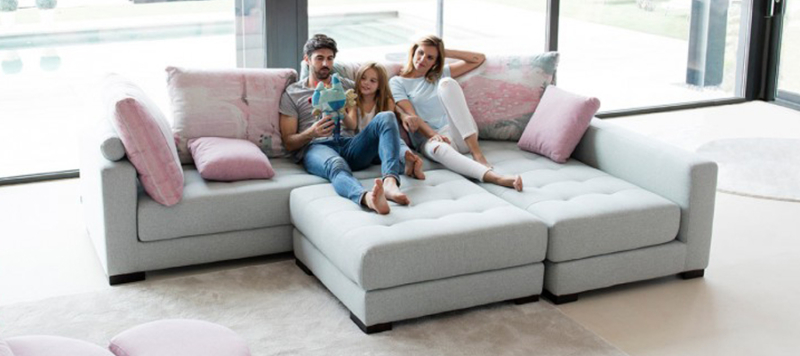 A family relaxing on this increadible sofa made in Spain.