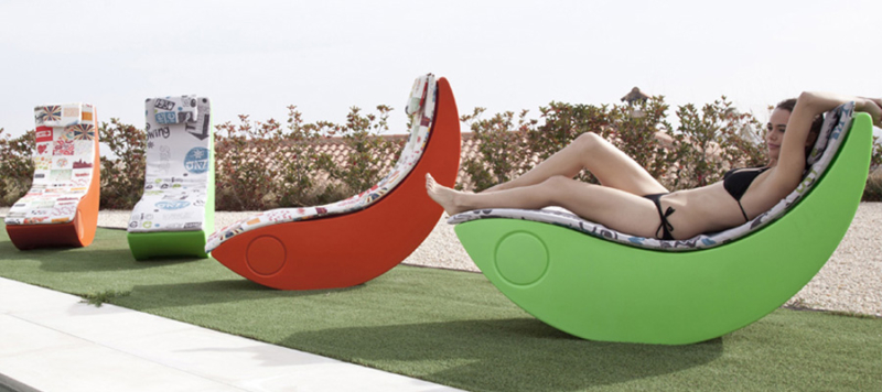 Colourful sun loungers for outdoors in green orange white colours.