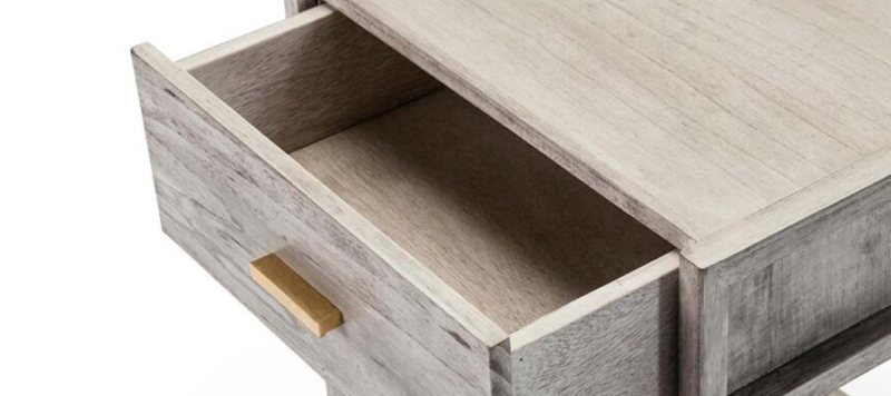 Drawer made by wood in grey colour.