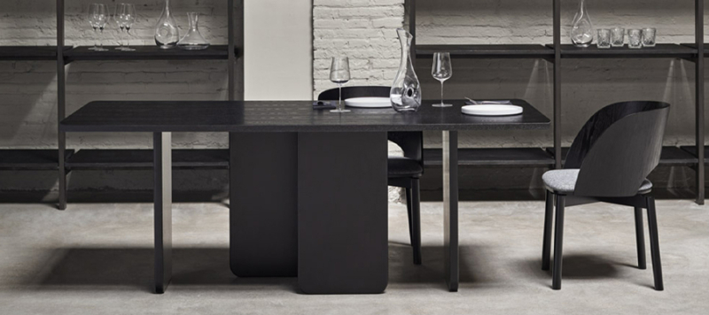 Black dining table in dining room.